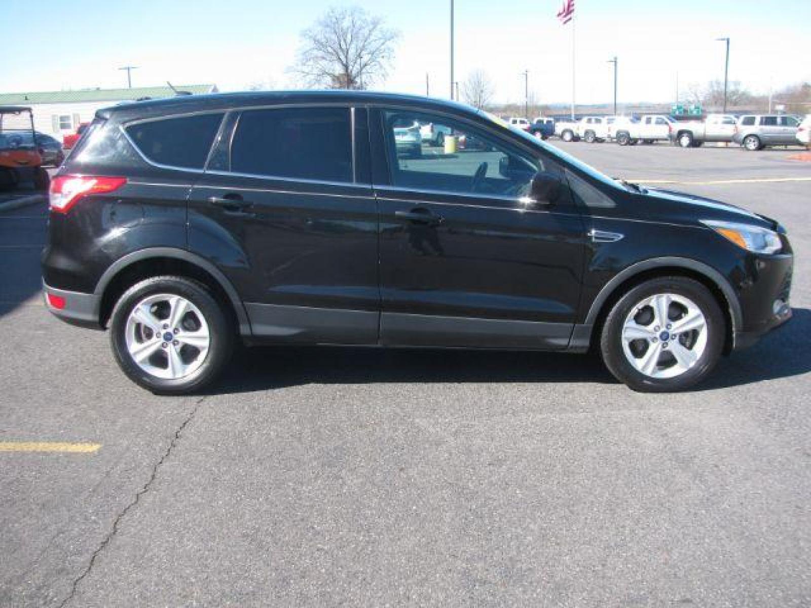 2015 Black Ford Escape SE FWD (1FMCU0G99FU) with an 2.0L L4 DOHC 16V engine, 6-Speed Automatic transmission, located at 2443 Albert Pike, Hot Springs, AR, 71913, (501) 623-6255, 34.492222, -93.109993 - Photo #1