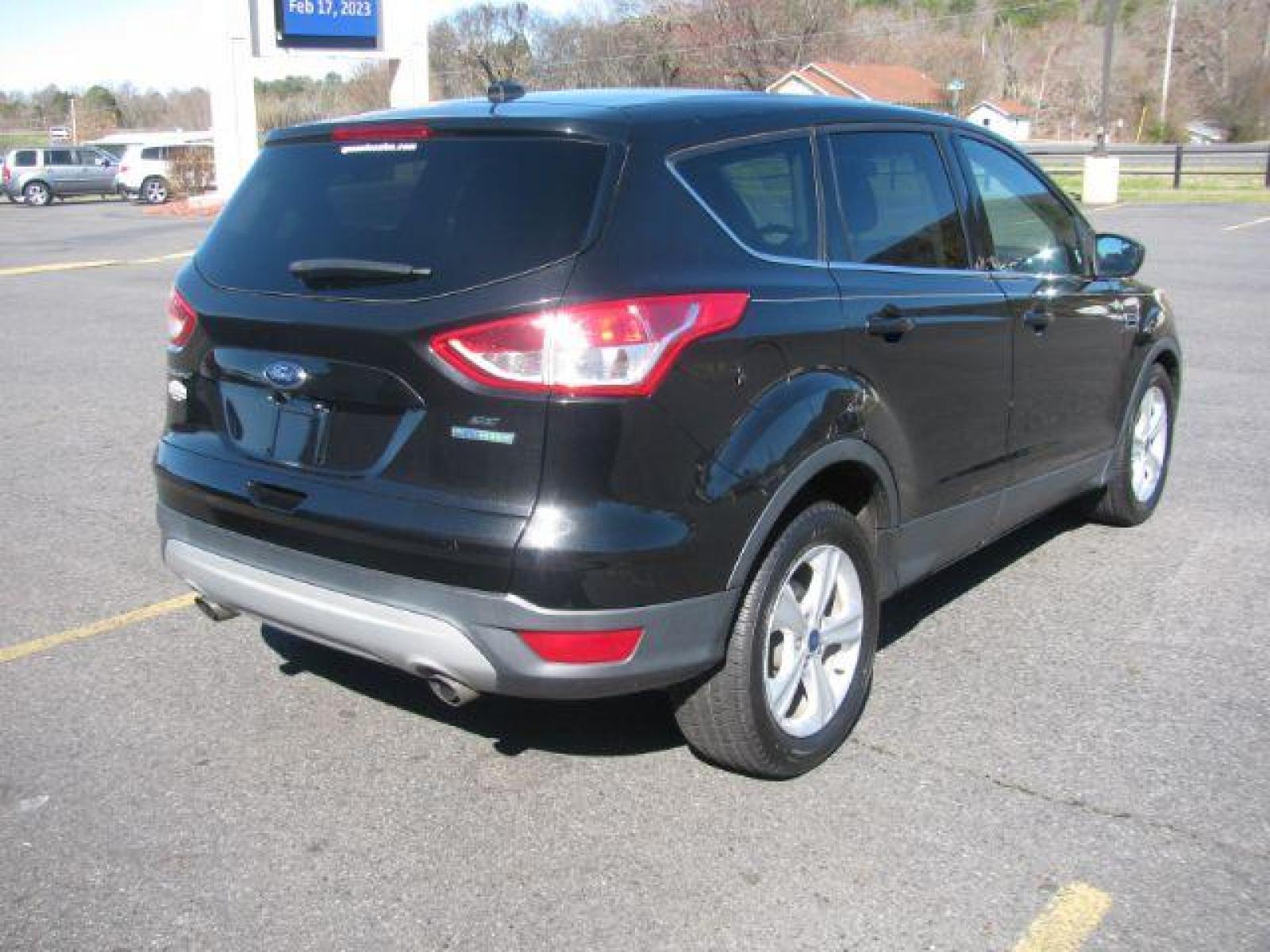 2015 Black Ford Escape SE FWD (1FMCU0G99FU) with an 2.0L L4 DOHC 16V engine, 6-Speed Automatic transmission, located at 2443 Albert Pike, Hot Springs, AR, 71913, (501) 623-6255, 34.492222, -93.109993 - Photo #2