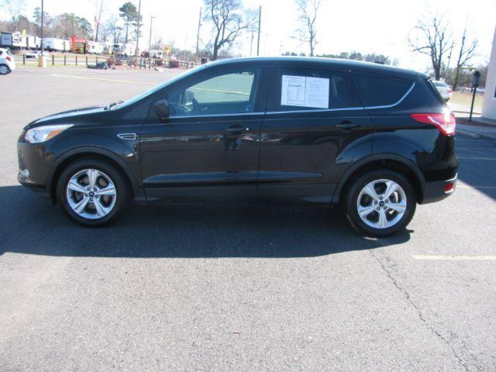 2015 Black Ford Escape SE FWD (1FMCU0G99FU) with an 2.0L L4 DOHC 16V engine, 6-Speed Automatic transmission, located at 2443 Albert Pike, Hot Springs, AR, 71913, (501) 623-6255, 34.492222, -93.109993 - Photo #4
