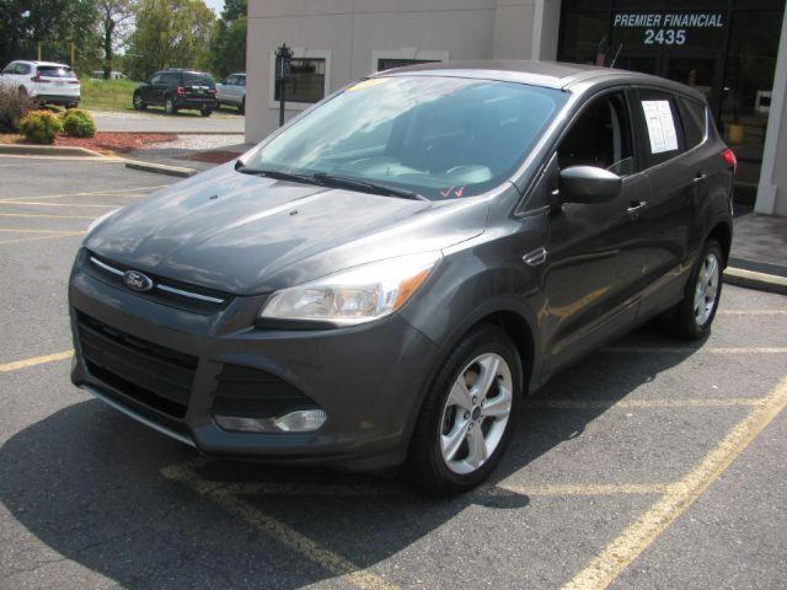2016 Gray Ford Escape SE FWD (1FMCU0G75GU) with an 2.5L L4 DOHC 16V engine, 6-Speed Automatic transmission, located at 2443 Albert Pike, Hot Springs, AR, 71913, (501) 623-6255, 34.492222, -93.109993 - LISTED FEATURES MAY BE OPTIONAL AND NOT INCLUDED ON THIS VEHICLE!!! - Photo #0