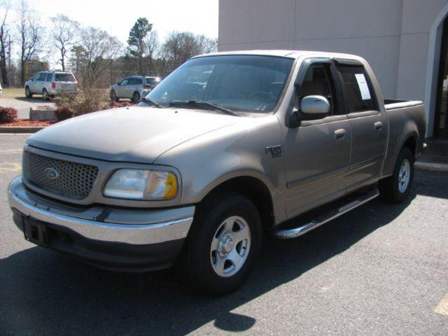 2002 Tan Ford F-150 XLT SuperCrew Short Bed 2WD (1FTRW07642K) with an 4.6L V8 SOHC 16V engine, 4-Speed Automatic transmission, located at 2443 Albert Pike, Hot Springs, AR, 71913, (501) 623-6255, 34.492222, -93.109993 - Photo#0