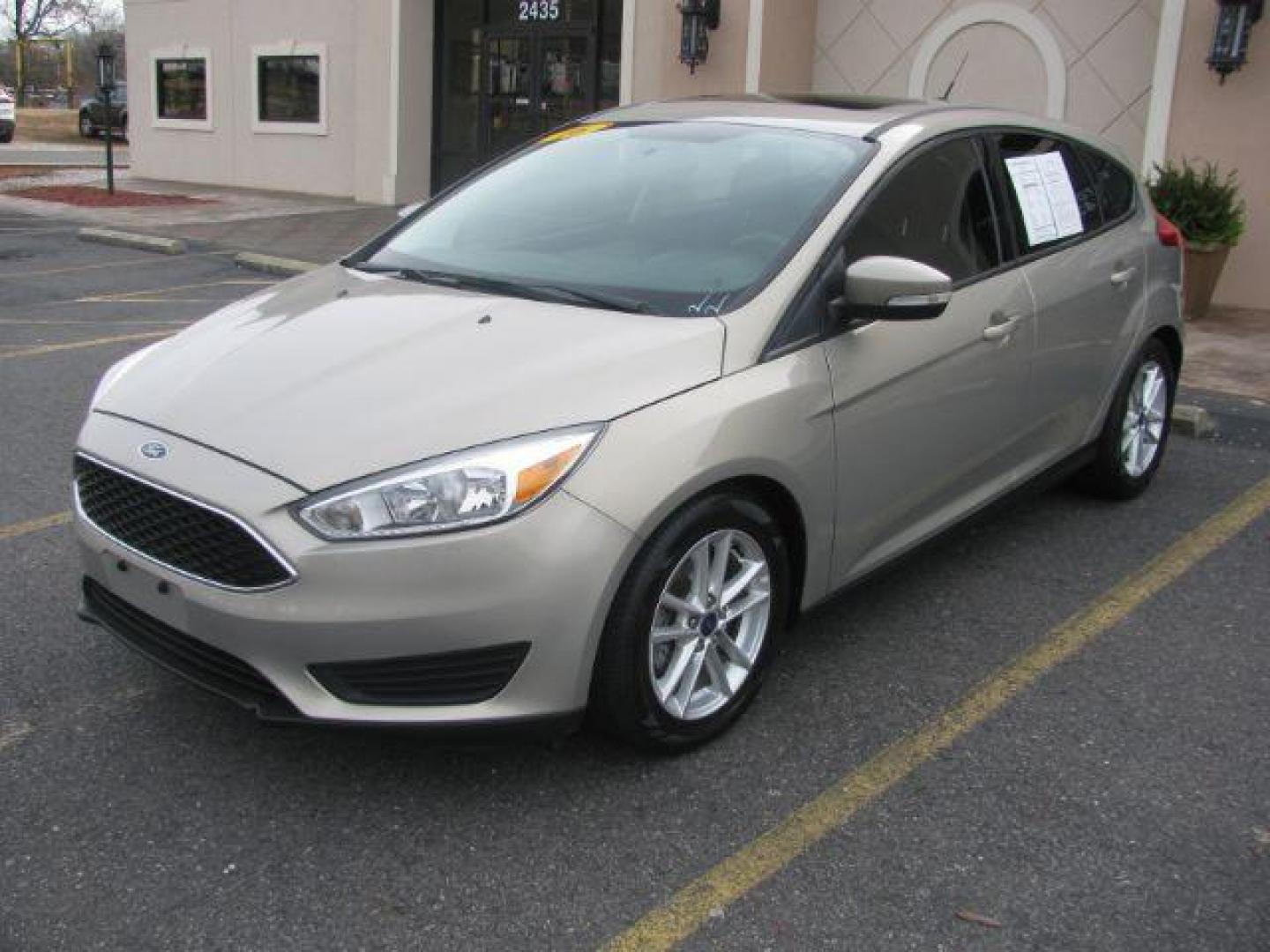 2016 Beige Ford Focus SE Hatch (1FADP3K25GL) with an 2.0L L4 DOHC 16V engine, located at 2443 Albert Pike, Hot Springs, AR, 71913, (501) 623-6255, 34.492222, -93.109993 - LISTED FEATURES MAY BE OPTIONAL AND NOT INCLUDED ON THIS VEHICLE!!! - Photo#0