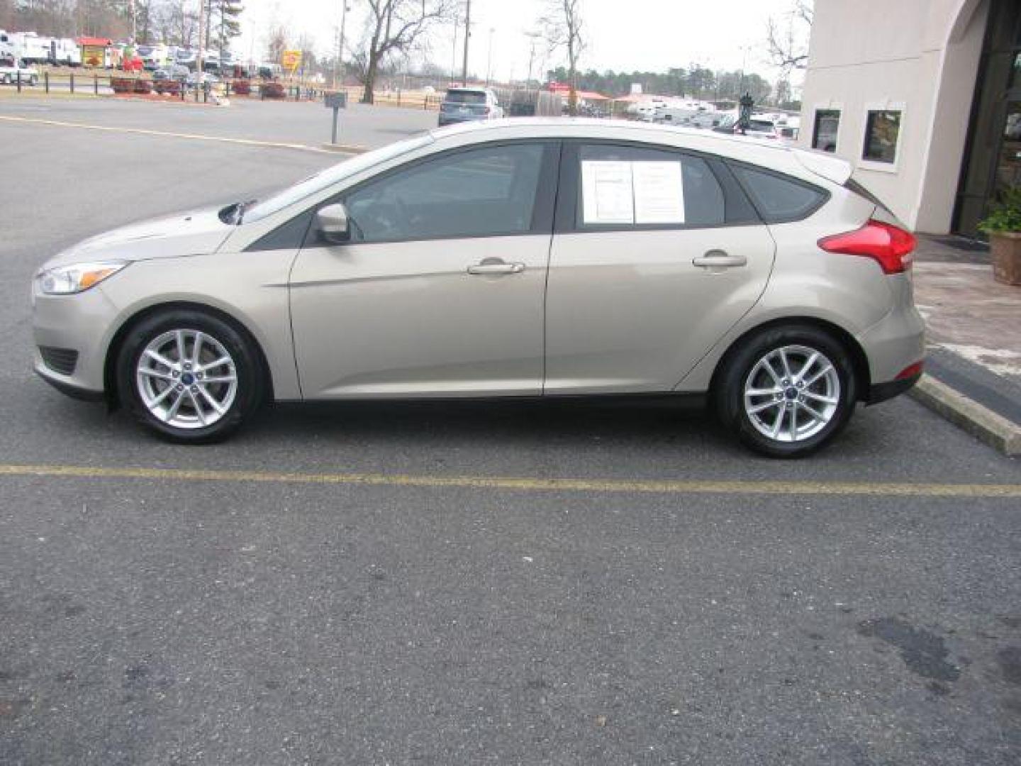 2016 Beige Ford Focus SE Hatch (1FADP3K25GL) with an 2.0L L4 DOHC 16V engine, located at 2443 Albert Pike, Hot Springs, AR, 71913, (501) 623-6255, 34.492222, -93.109993 - LISTED FEATURES MAY BE OPTIONAL AND NOT INCLUDED ON THIS VEHICLE!!! - Photo#1