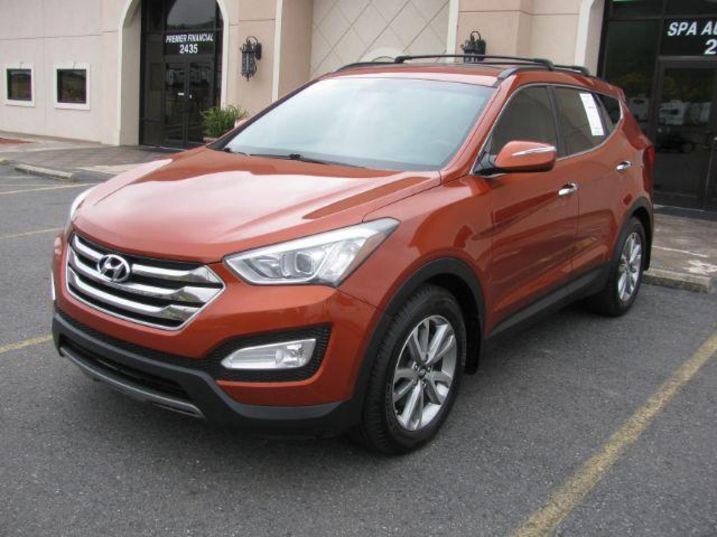 2016 Orange Hyundai Santa Fe Sport 2.0T AWD (5XYZUDLA5GG) with an 2.0L L4 DOHC 16V TURBO engine, 6-Speed Automatic transmission, located at 2443 Albert Pike, Hot Springs, AR, 71913, (501) 623-6255, 34.492222, -93.109993 - Photo#0