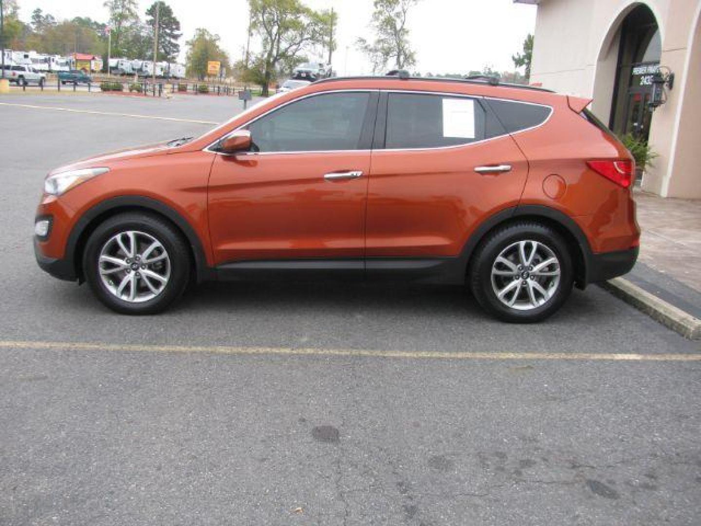 2016 Orange Hyundai Santa Fe Sport 2.0T AWD (5XYZUDLA5GG) with an 2.0L L4 DOHC 16V TURBO engine, 6-Speed Automatic transmission, located at 2443 Albert Pike, Hot Springs, AR, 71913, (501) 623-6255, 34.492222, -93.109993 - Photo#1