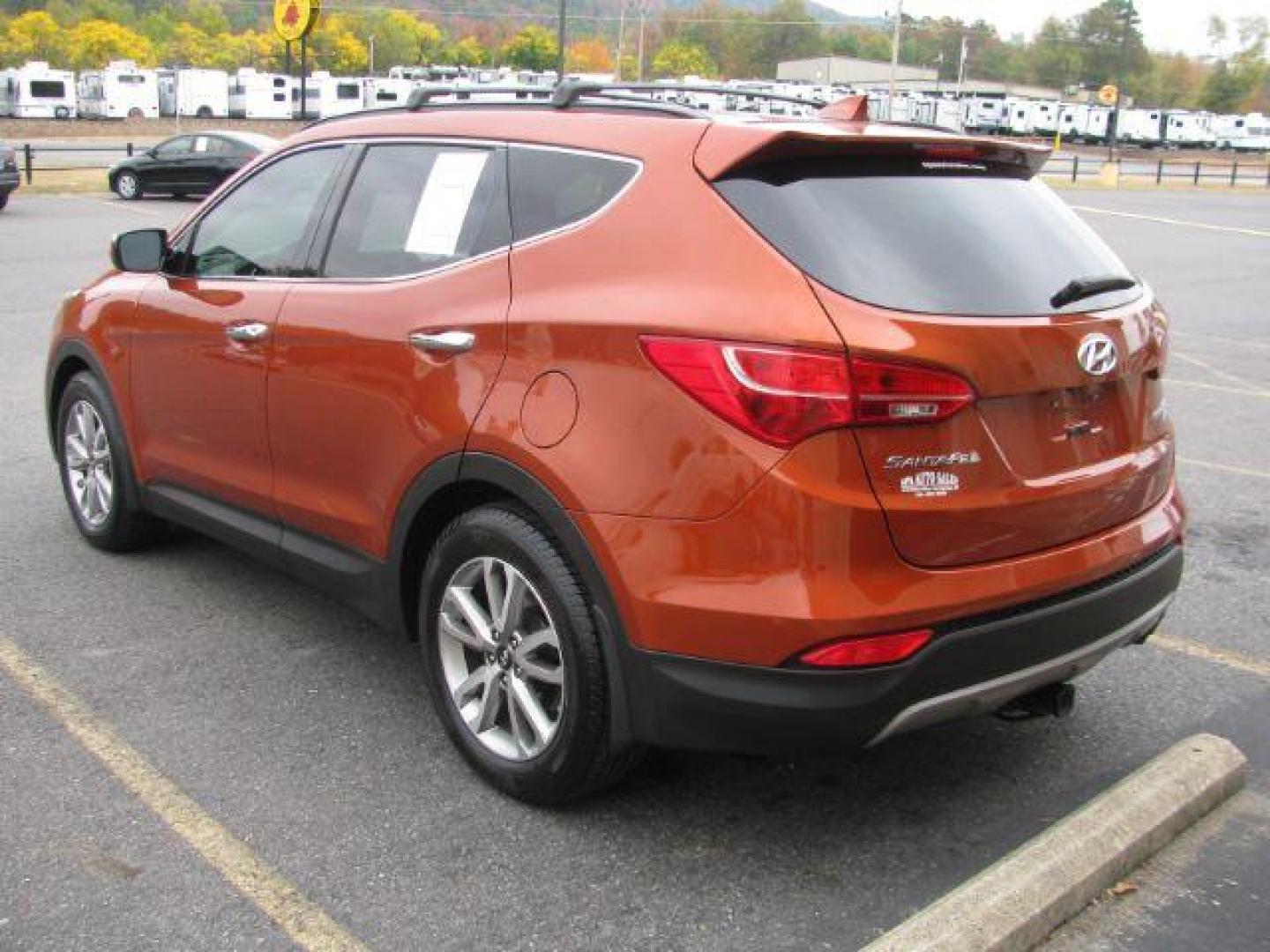 2016 Orange Hyundai Santa Fe Sport 2.0T AWD (5XYZUDLA5GG) with an 2.0L L4 DOHC 16V TURBO engine, 6-Speed Automatic transmission, located at 2443 Albert Pike, Hot Springs, AR, 71913, (501) 623-6255, 34.492222, -93.109993 - Photo#2