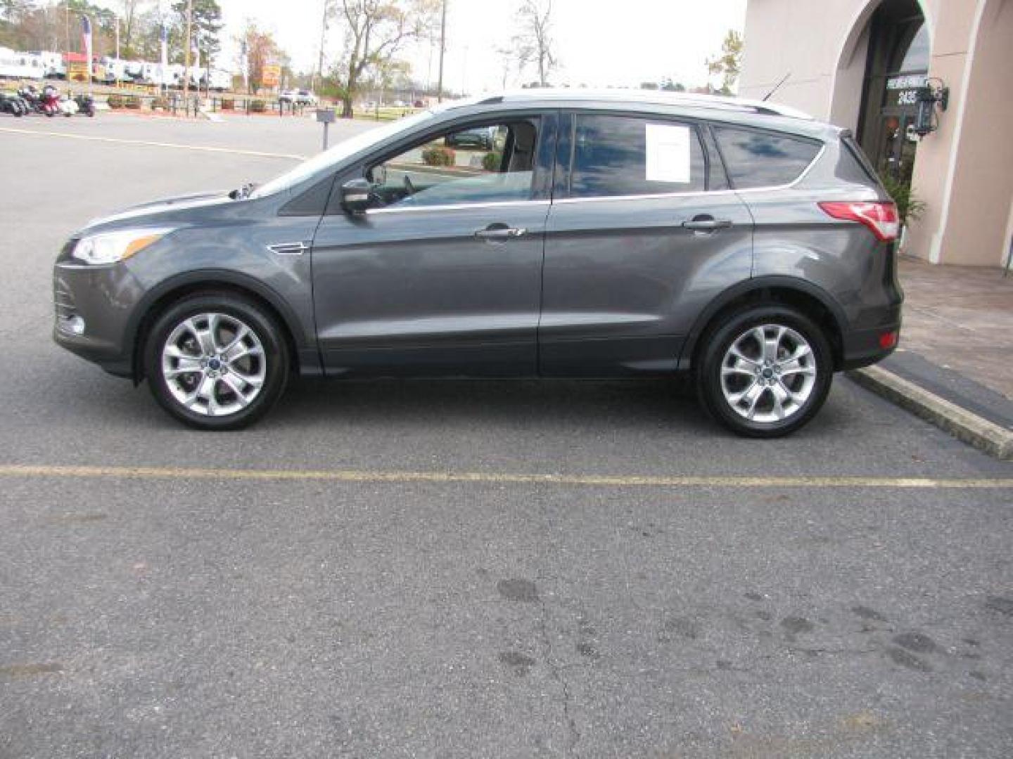2016 Gray Ford Escape Titanium FWD (1FMCU0J99GU) with an 2.0L L4 DOHC 16V engine, 6-Speed Automatic transmission, located at 2443 Albert Pike, Hot Springs, AR, 71913, (501) 623-6255, 34.492222, -93.109993 - Photo#1