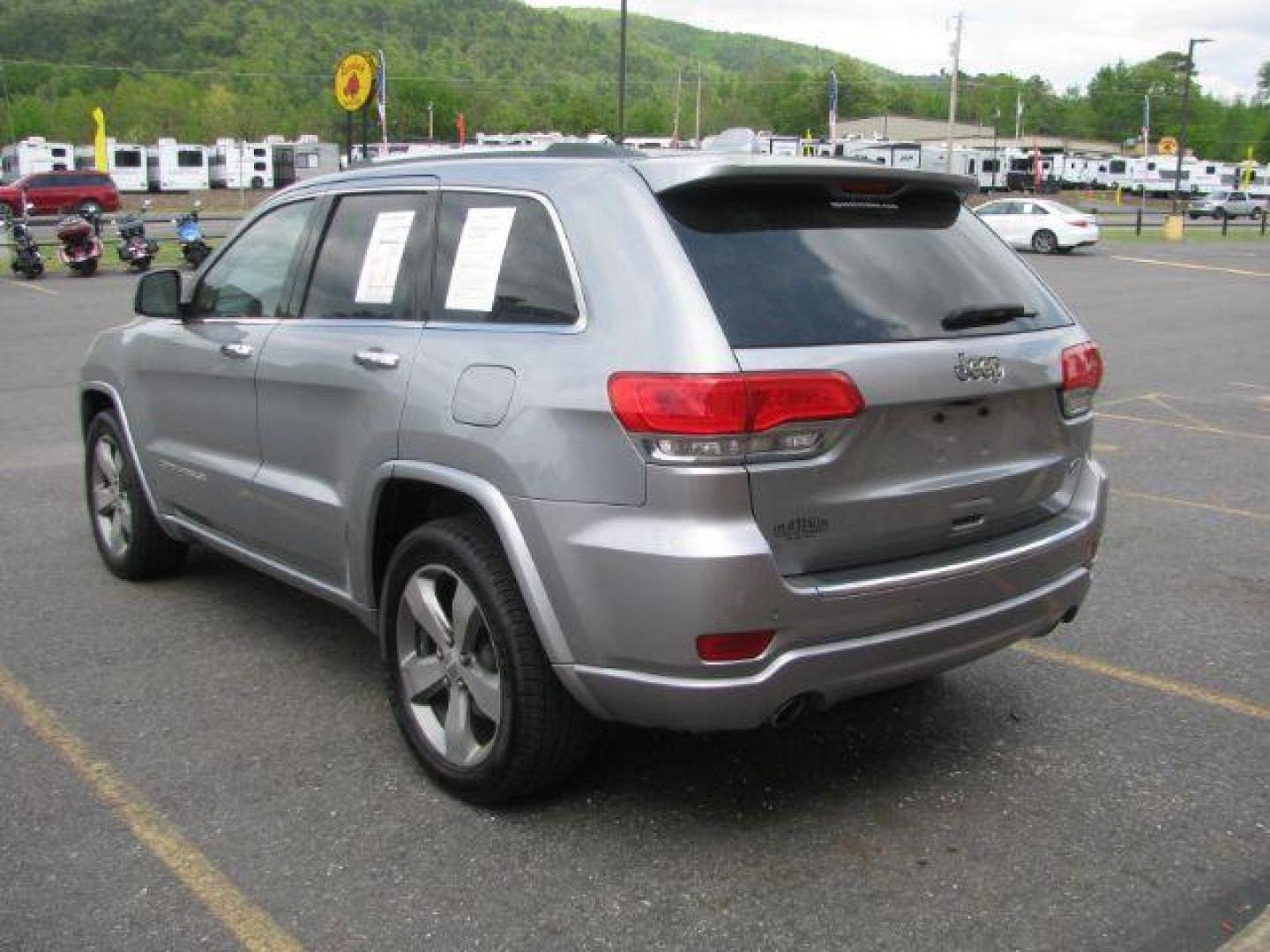 2014 Silver Jeep Grand Cherokee Overland (1C4RJECG4EC) with an 3.6L V-6 DOHC engine, Automatic transmission, located at 2443 Albert Pike, Hot Springs, AR, 71913, (501) 623-6255, 34.492222, -93.109993 - Photo#2