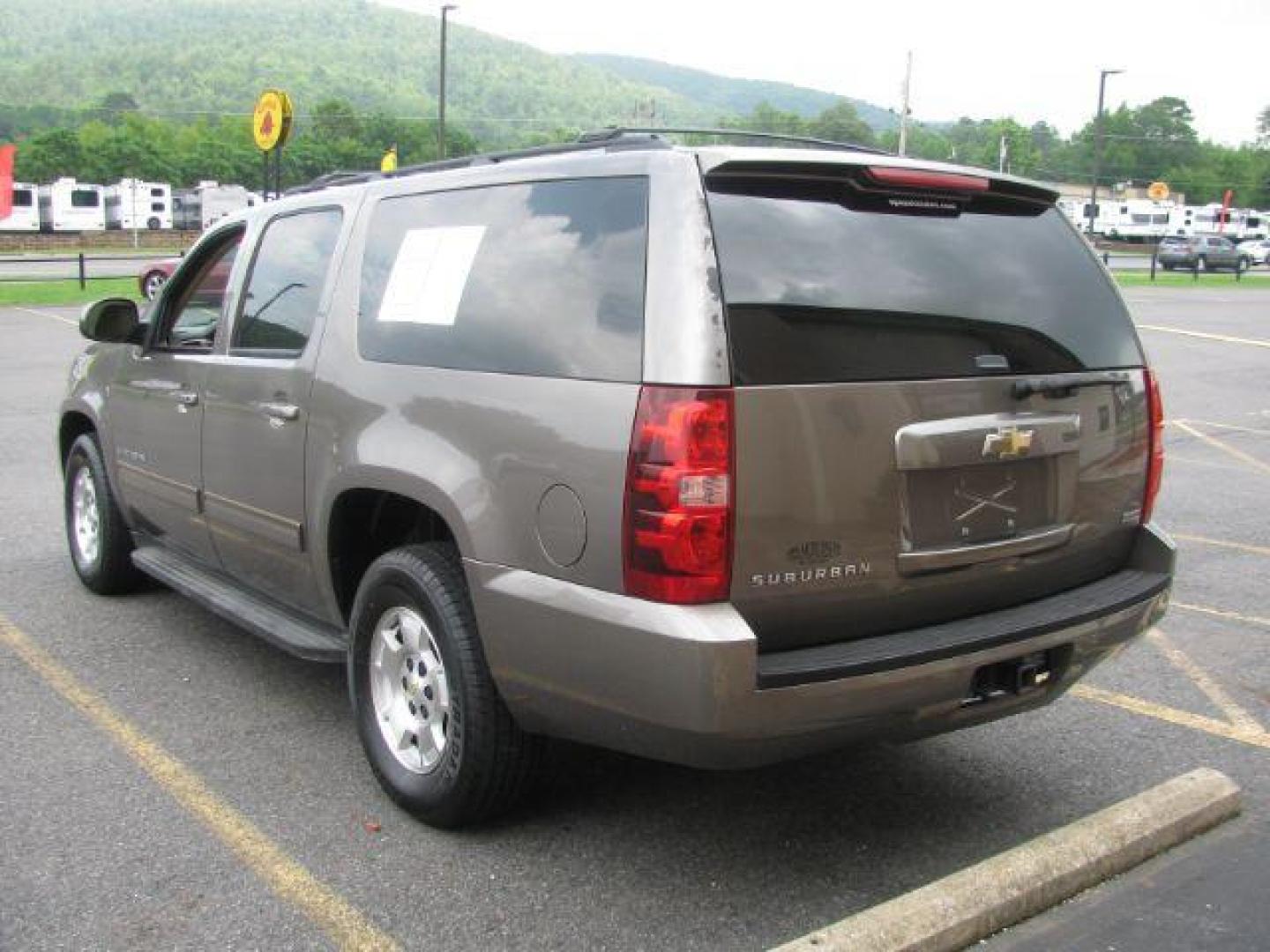 2011 Brown Chevrolet Suburban 1500 LS (1GNSCHE0XBR) with an Vortec 5.3L V-8 variable valve control engine, Automatic transmission, located at 2443 Albert Pike, Hot Springs, AR, 71913, (501) 623-6255, 34.492222, -93.109993 - Photo#2
