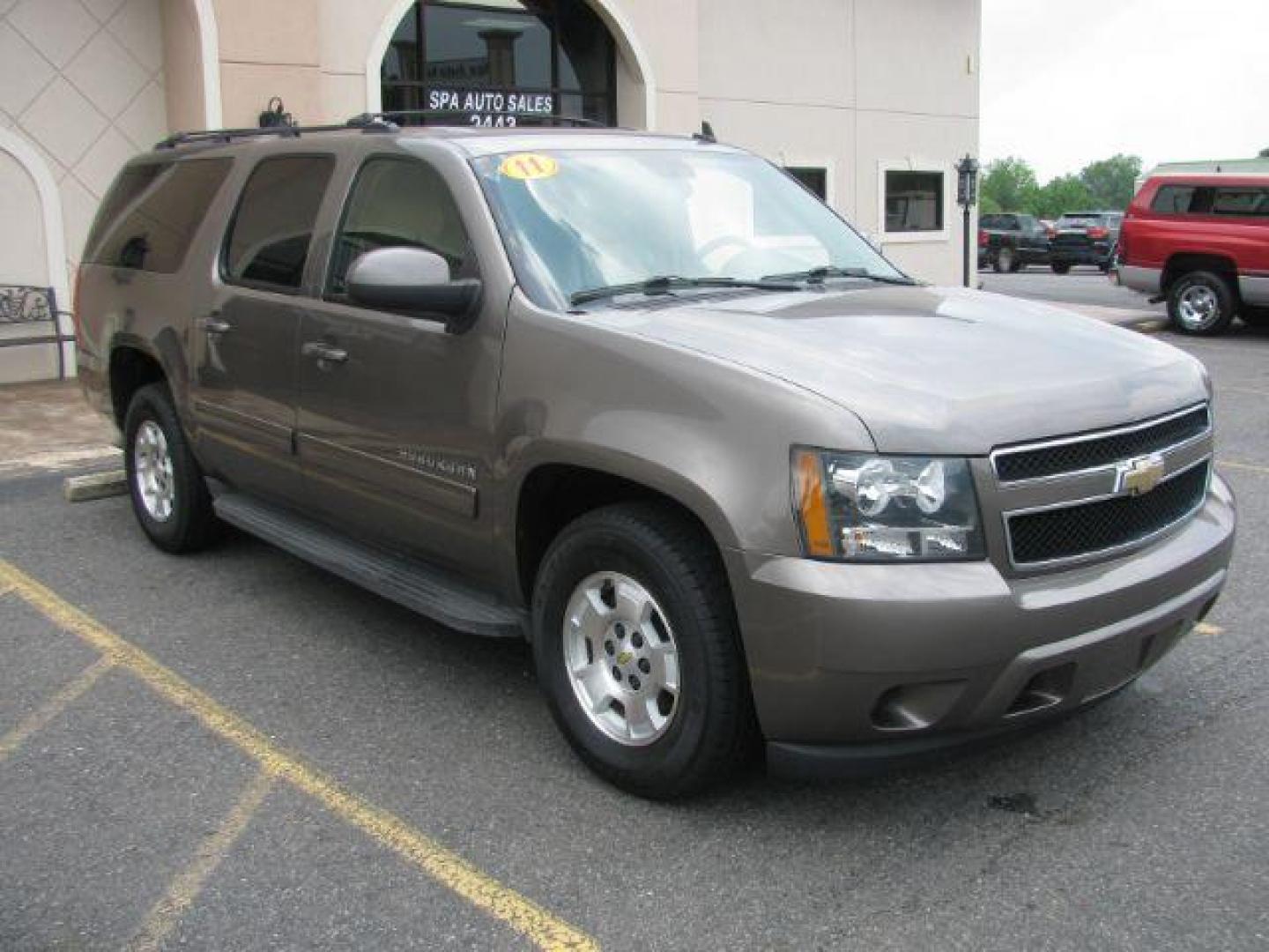 2011 Brown Chevrolet Suburban 1500 LS (1GNSCHE0XBR) with an Vortec 5.3L V-8 variable valve control engine, Automatic transmission, located at 2443 Albert Pike, Hot Springs, AR, 71913, (501) 623-6255, 34.492222, -93.109993 - Photo#5