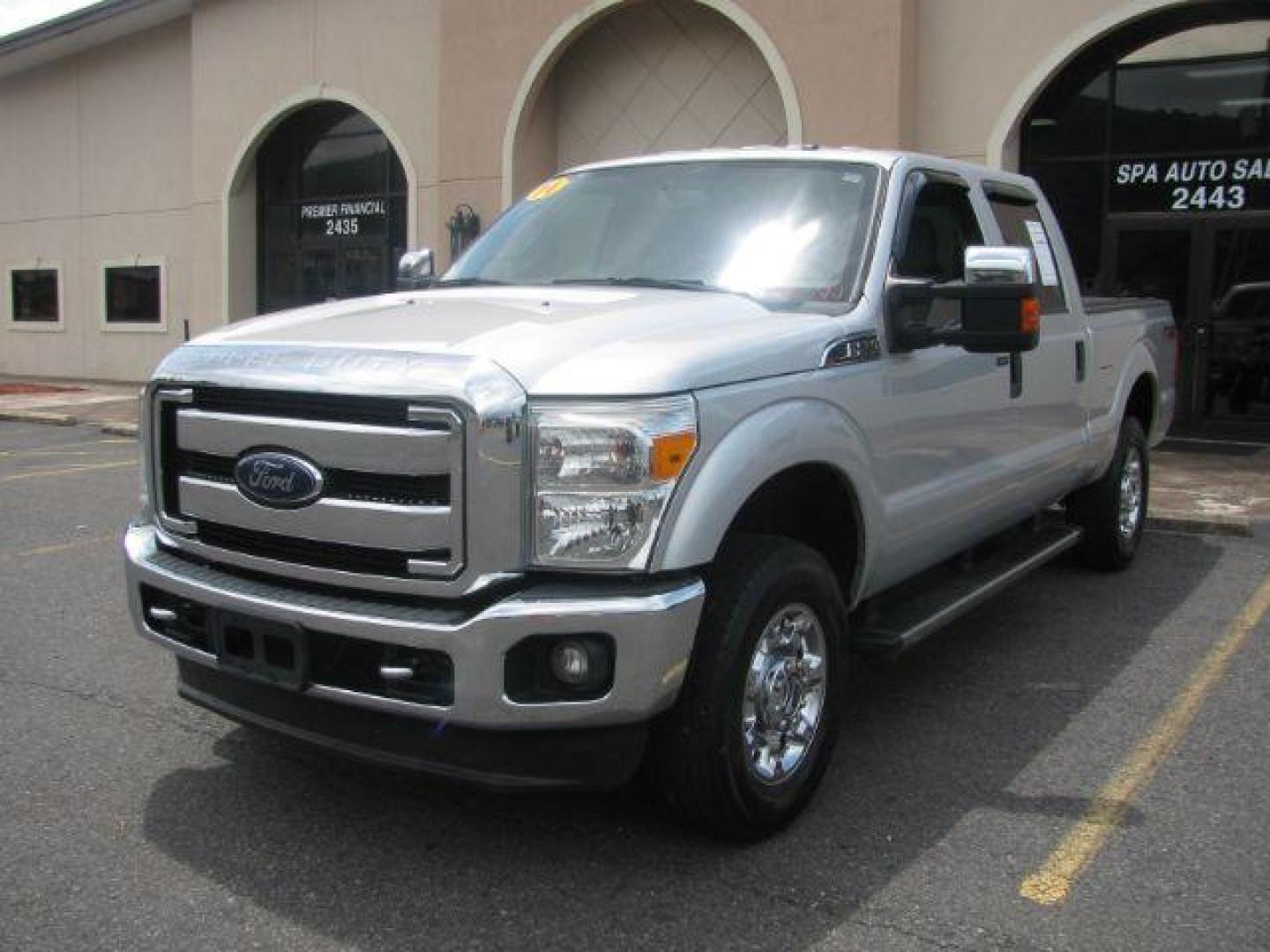 2014 Silver Ford F-250 SD XLT Crew Cab 4WD (1FT7W2B66EE) with an 6.2L V8 OHV 16V engine, 6-Speed Automatic transmission, located at 2443 Albert Pike, Hot Springs, AR, 71913, (501) 623-6255, 34.492222, -93.109993 - Photo#0