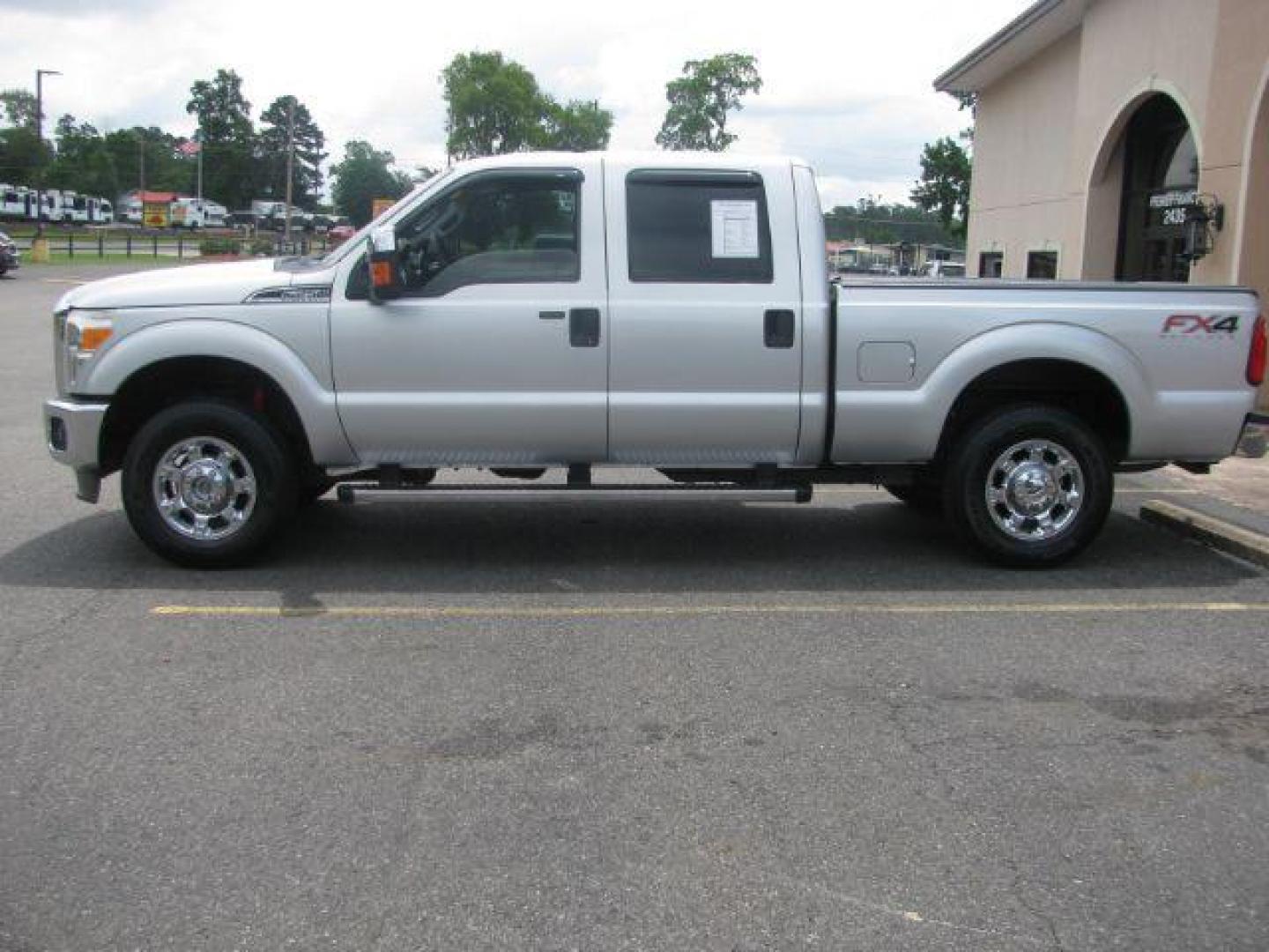 2014 Silver Ford F-250 SD XLT Crew Cab 4WD (1FT7W2B66EE) with an 6.2L V8 OHV 16V engine, 6-Speed Automatic transmission, located at 2443 Albert Pike, Hot Springs, AR, 71913, (501) 623-6255, 34.492222, -93.109993 - Photo#1