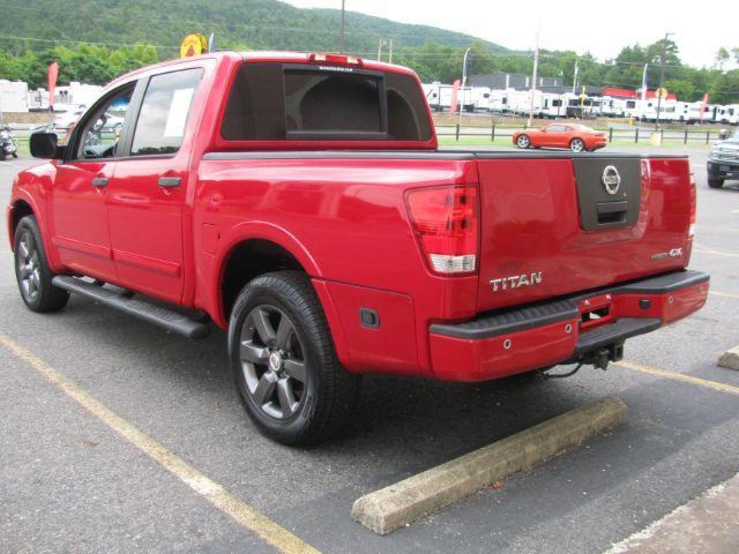 2012 Red Nissan Titan SV (1N6BA0EJ8CN) with an Endurance 5.6L V-8 DOHC engine, Automatic transmission, located at 2443 Albert Pike, Hot Springs, AR, 71913, (501) 623-6255, 34.492222, -93.109993 - Photo#2