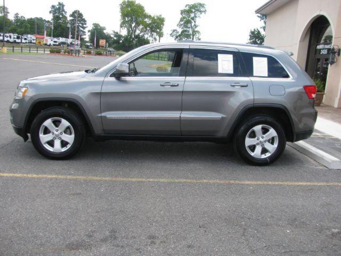 2011 Gray Jeep Grand Cherokee Laredo (1J4RR4GG3BC) with an 3.6L V-6 DOHC engine, Automatic transmission, located at 2443 Albert Pike, Hot Springs, AR, 71913, (501) 623-6255, 34.492222, -93.109993 - Photo#1