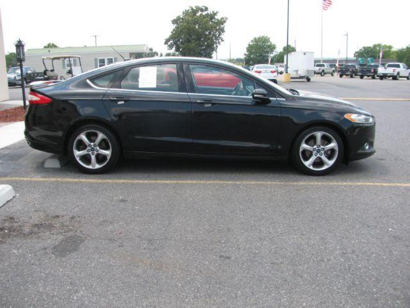 2016 Black Ford Fusion SE (3FA6P0H91GR) with an EcoBoost 2L I-4 gasoline direct injection engine, Automatic transmission, located at 2443 Albert Pike, Hot Springs, AR, 71913, (501) 623-6255, 34.492222, -93.109993 - Photo#4