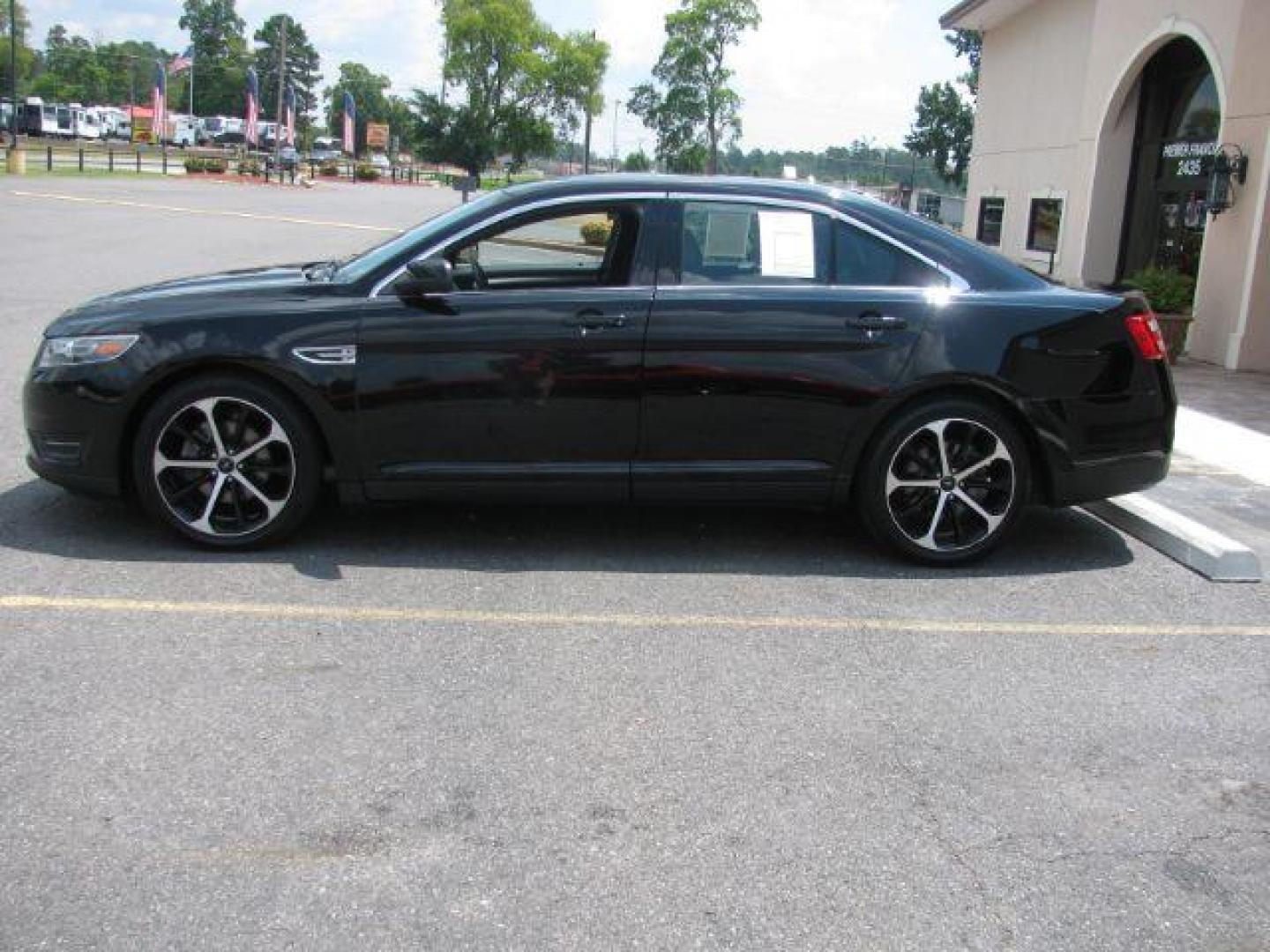 2016 Black Ford Taurus SEL (1FAHP2E87GG) with an EcoBoost 2L I-4 gasoline direct injection engine, Automatic transmission, located at 2443 Albert Pike, Hot Springs, AR, 71913, (501) 623-6255, 34.492222, -93.109993 - Photo#1