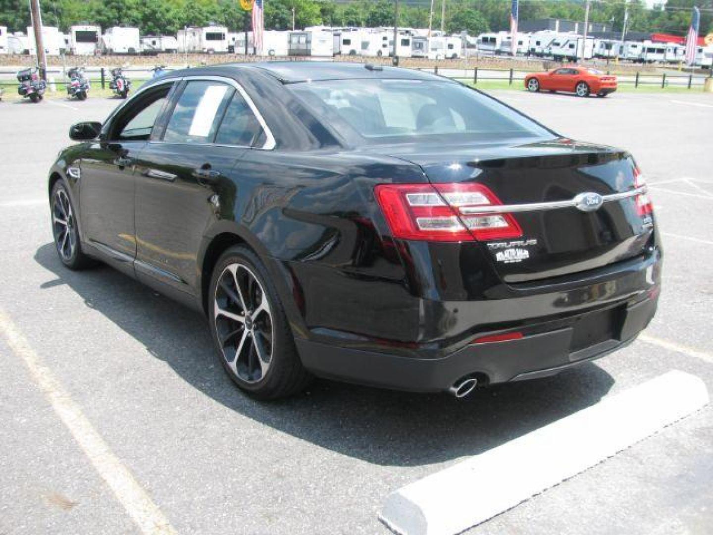 2016 Black Ford Taurus SEL (1FAHP2E87GG) with an EcoBoost 2L I-4 gasoline direct injection engine, Automatic transmission, located at 2443 Albert Pike, Hot Springs, AR, 71913, (501) 623-6255, 34.492222, -93.109993 - Photo#2