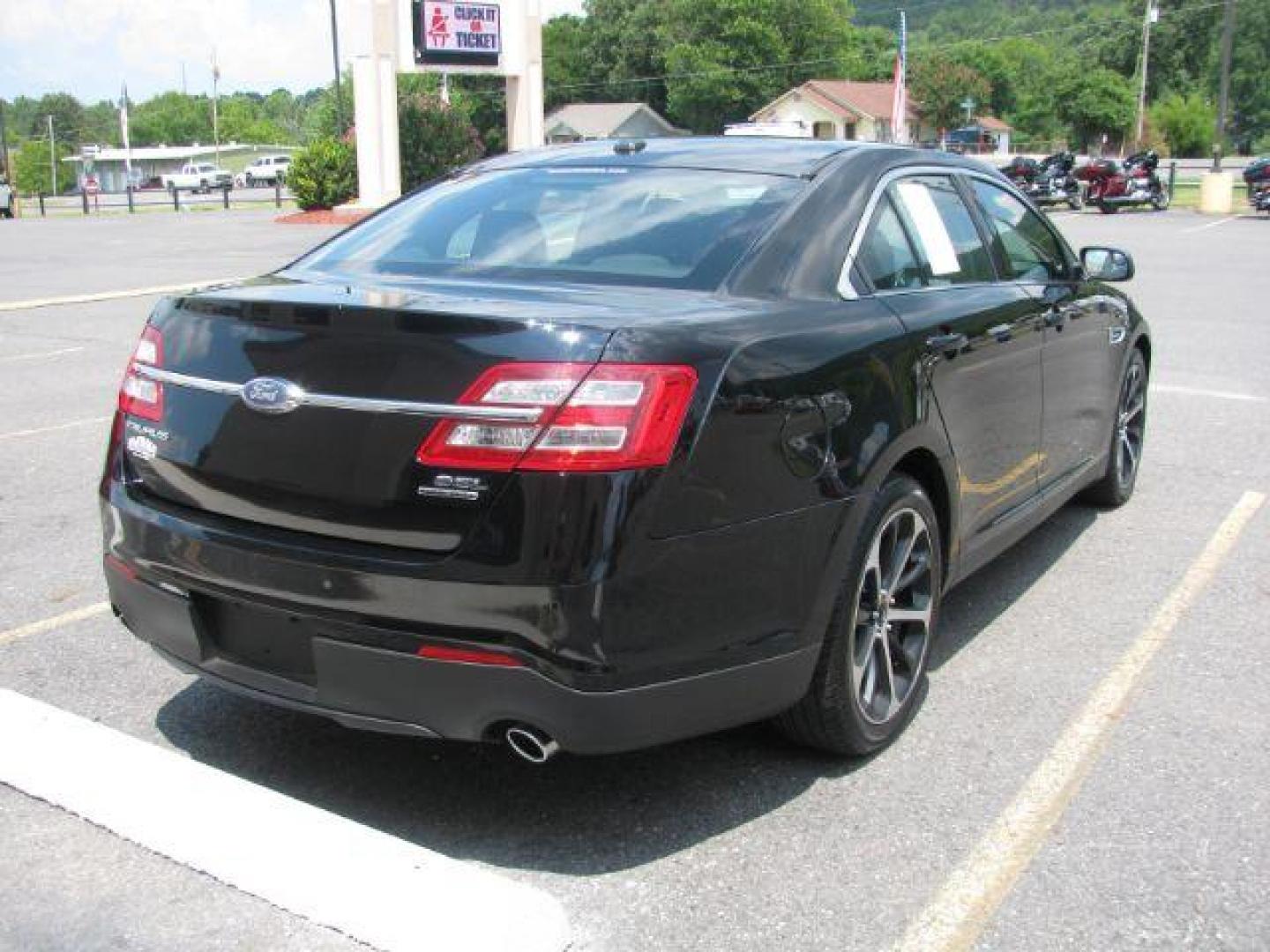 2016 Black Ford Taurus SEL (1FAHP2E87GG) with an EcoBoost 2L I-4 gasoline direct injection engine, Automatic transmission, located at 2443 Albert Pike, Hot Springs, AR, 71913, (501) 623-6255, 34.492222, -93.109993 - Photo#3