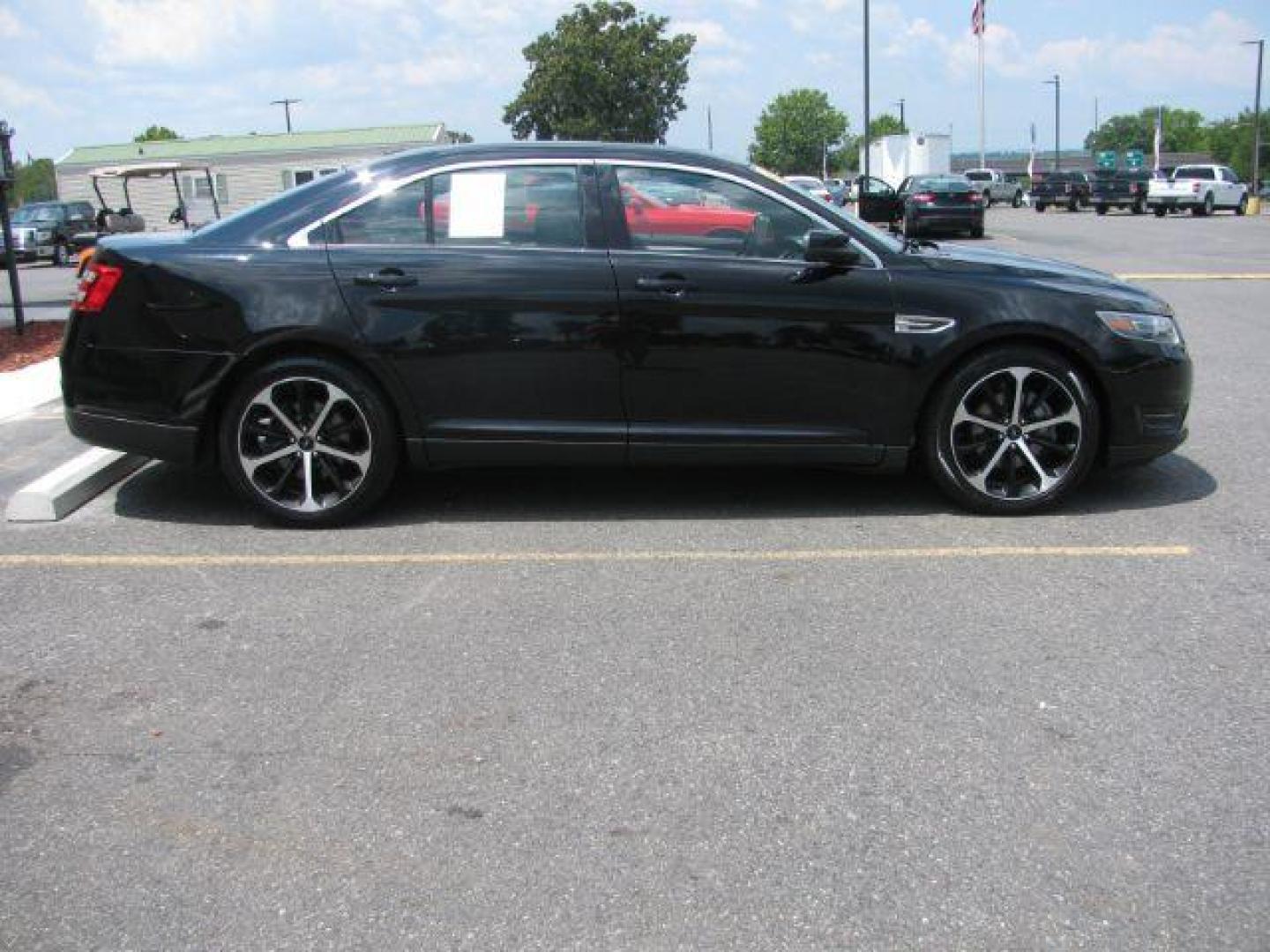 2016 Black Ford Taurus SEL (1FAHP2E87GG) with an EcoBoost 2L I-4 gasoline direct injection engine, Automatic transmission, located at 2443 Albert Pike, Hot Springs, AR, 71913, (501) 623-6255, 34.492222, -93.109993 - Photo#4
