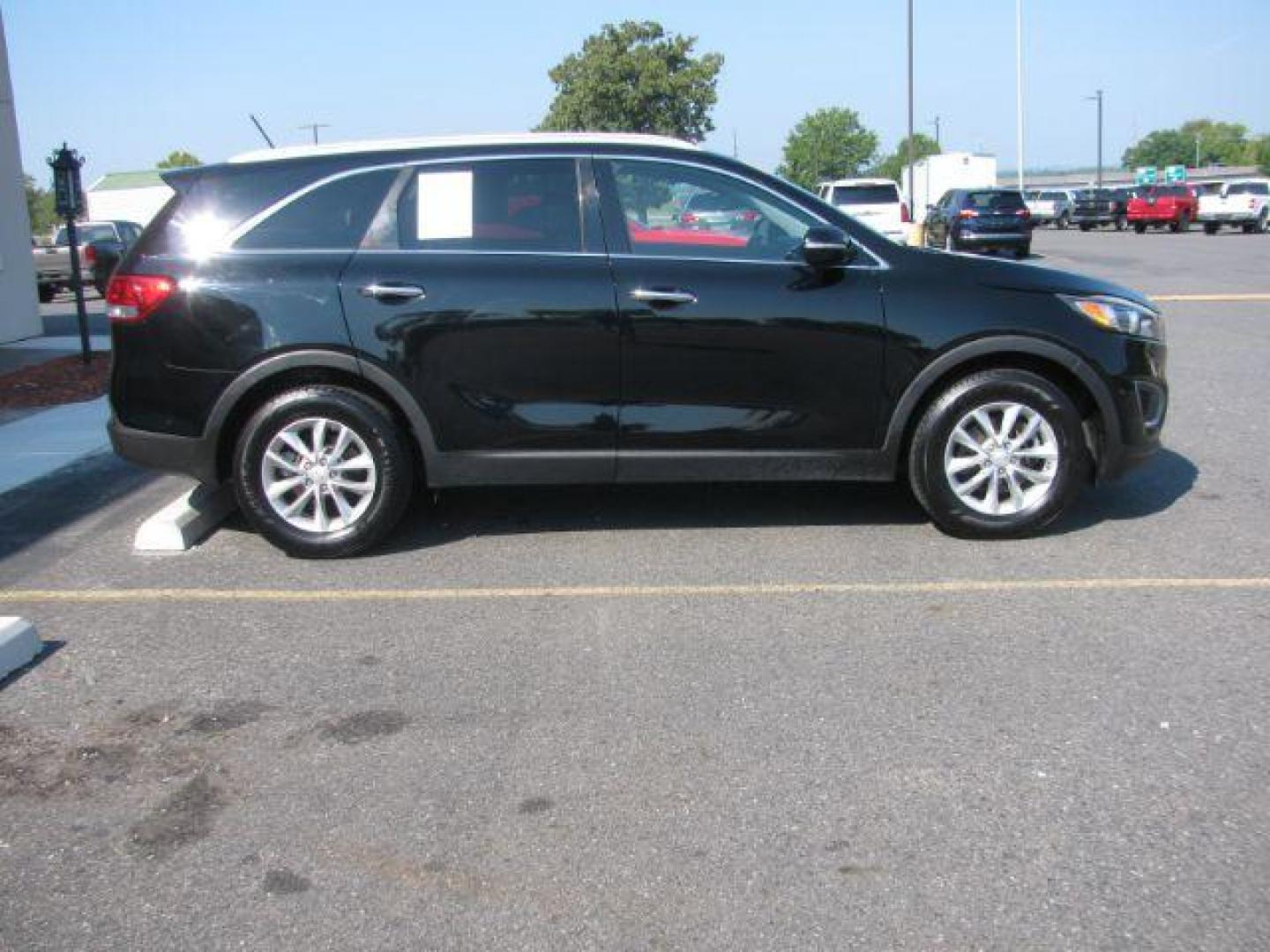 2016 Black Kia Sorento 2.4L LX (5XYPG4A33GG) with an 2.4L I-4 gasoline direct injection engine, Automatic transmission, located at 2443 Albert Pike, Hot Springs, AR, 71913, (501) 623-6255, 34.492222, -93.109993 - Photo#1