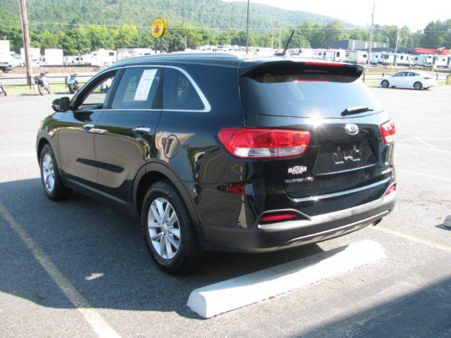 2016 Black Kia Sorento 2.4L LX (5XYPG4A33GG) with an 2.4L I-4 gasoline direct injection engine, Automatic transmission, located at 2443 Albert Pike, Hot Springs, AR, 71913, (501) 623-6255, 34.492222, -93.109993 - Photo#3