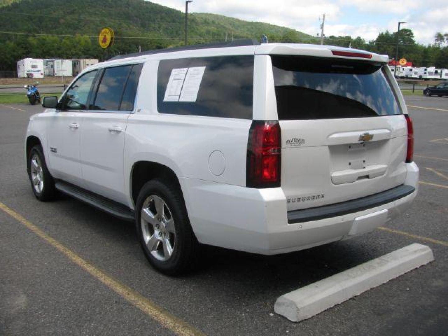 2016 White Chevrolet Suburban LT (1GNSKHKC1GR) with an EcoTec3 5.3L V-8 gasoline direct injection engine, Automatic transmission, located at 2443 Albert Pike, Hot Springs, AR, 71913, (501) 623-6255, 34.492222, -93.109993 - Photo#2