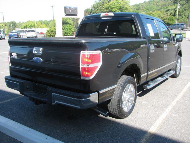 2010 Black Ford F-150 XLT SuperCrew 5.5-ft. Bed 2WD (1FTEW1C82AF) with an 4.6L V8 SOHC 24V engine, 4-Speed Automatic transmission, located at 2443 Albert Pike, Hot Springs, AR, 71913, (501) 623-6255, 34.492222, -93.109993 - Photo#2