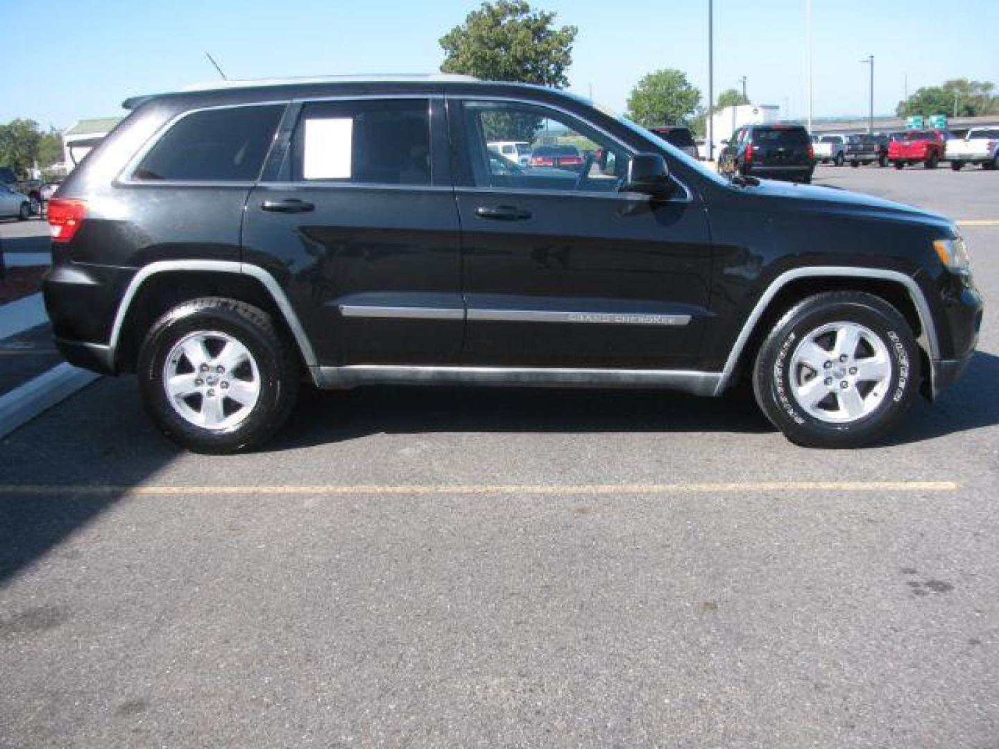 2012 Black Jeep Grand Cherokee Laredo (1C4RJEAG3CC) with an 3.6L V-6 DOHC engine, Automatic transmission, located at 2443 Albert Pike, Hot Springs, AR, 71913, (501) 623-6255, 34.492222, -93.109993 - Photo#1