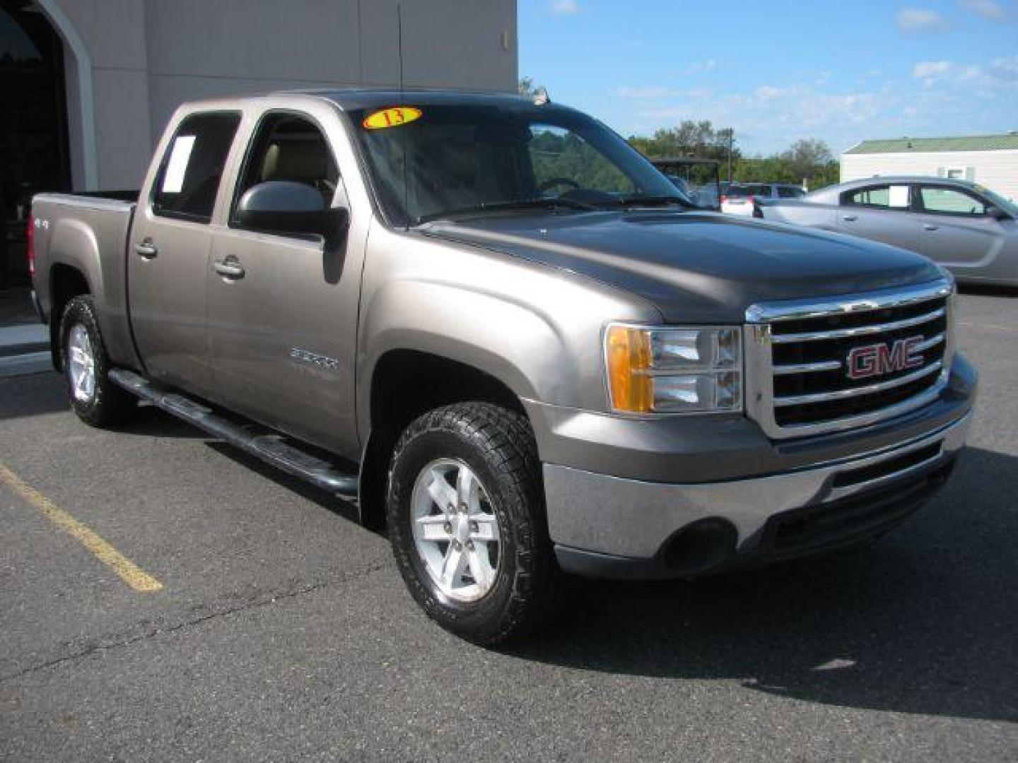 2013 Brown GMC Sierra 1500 SLT (3GTU2WE20DG) with an Vortec 5.3L V-8 variable valve control engine, Automatic transmission, located at 2443 Albert Pike, Hot Springs, AR, 71913, (501) 623-6255, 34.492222, -93.109993 - Photo#0