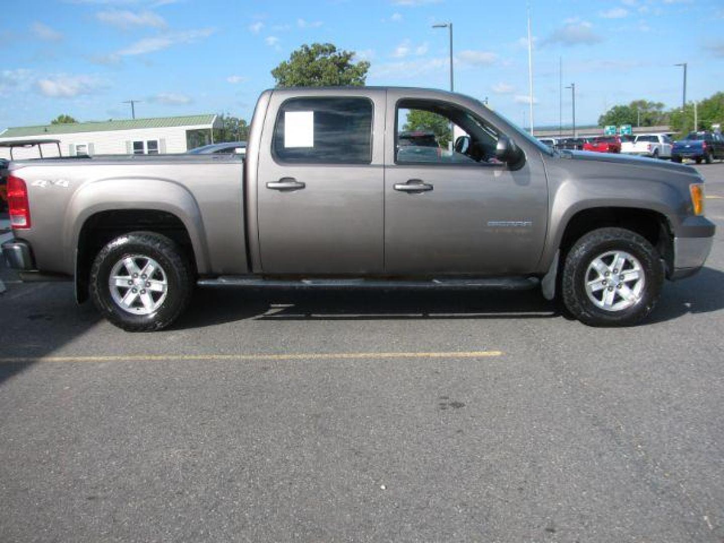 2013 Brown GMC Sierra 1500 SLT (3GTU2WE20DG) with an Vortec 5.3L V-8 variable valve control engine, Automatic transmission, located at 2443 Albert Pike, Hot Springs, AR, 71913, (501) 623-6255, 34.492222, -93.109993 - Photo#1