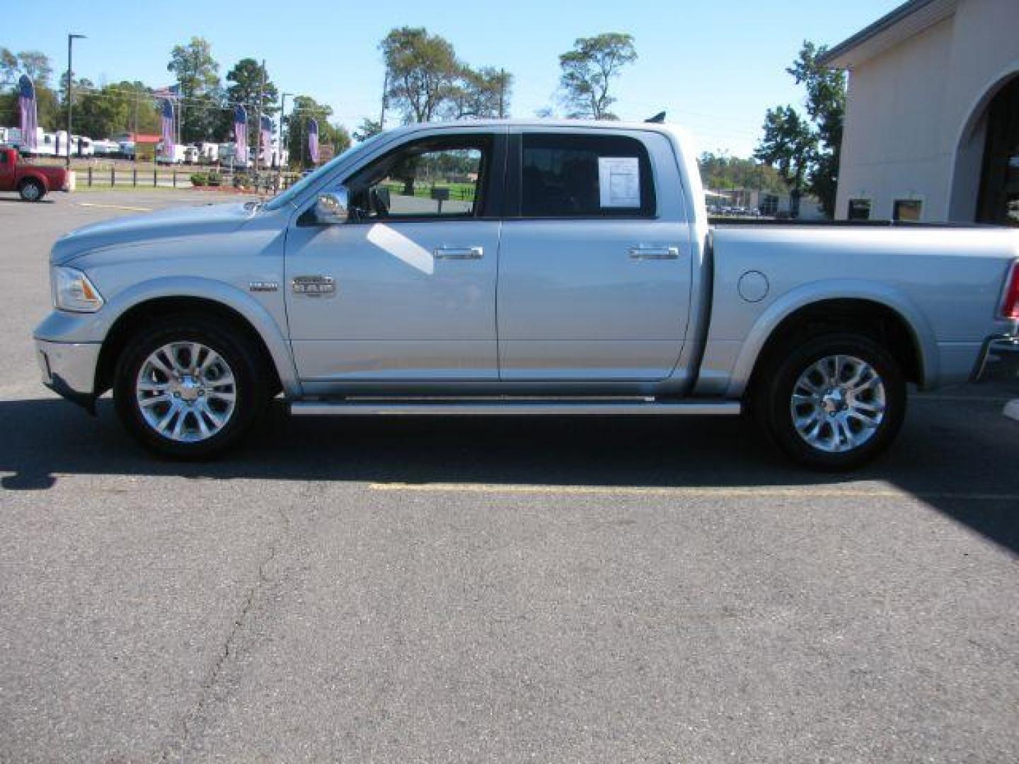 2015 Silver Ram 1500 Laramie Longhorn (1C6RR7PT8FS) with an HEMI 5.7L V-8 variable valve control engine, Automatic transmission, located at 2443 Albert Pike, Hot Springs, AR, 71913, (501) 623-6255, 34.492222, -93.109993 - Photo#1