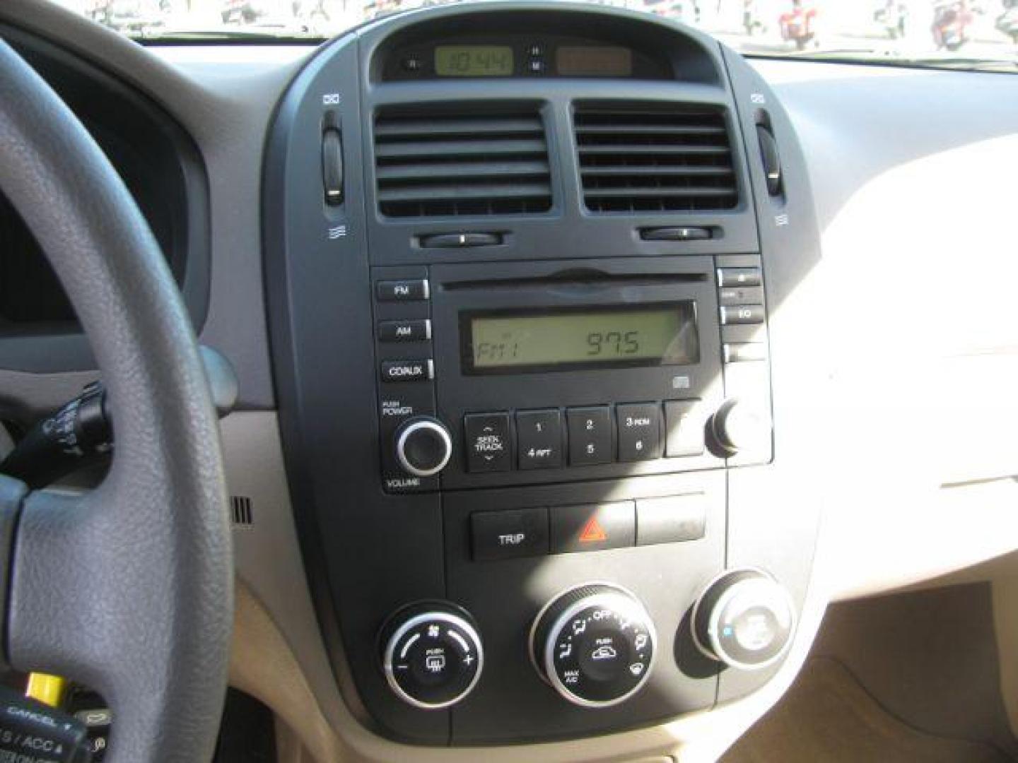 2007 Gold Kia Spectra EX (KNAFE121675) with an 2L I-4 DOHC engine, located at 2443 Albert Pike, Hot Springs, AR, 71913, (501) 623-6255, 34.492222, -93.109993 - Photo#9