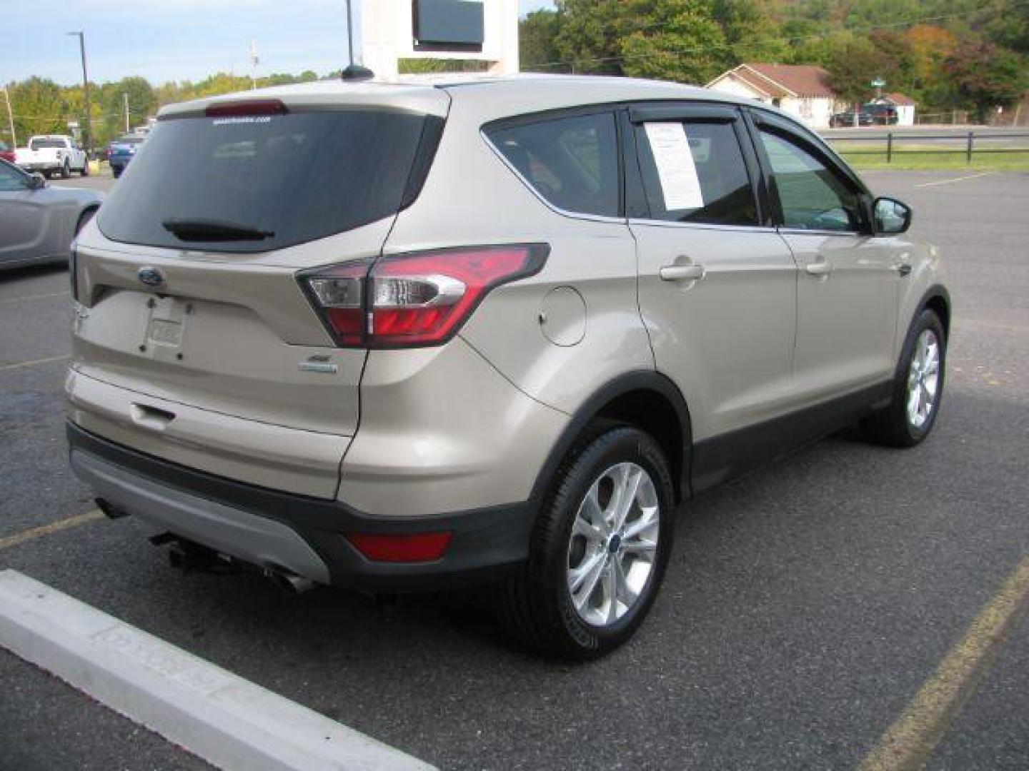 2017 Gold Ford Escape SE (1FMCU0GD1HU) with an EcoBoost 1.5L I-4 gasoline direct injection engine, Automatic transmission, located at 2443 Albert Pike, Hot Springs, AR, 71913, (501) 623-6255, 34.492222, -93.109993 - Photo#2
