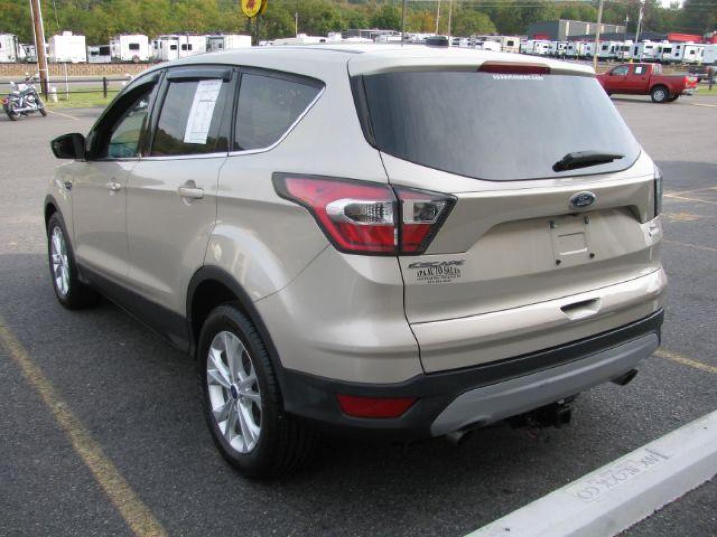 2017 Gold Ford Escape SE (1FMCU0GD1HU) with an EcoBoost 1.5L I-4 gasoline direct injection engine, Automatic transmission, located at 2443 Albert Pike, Hot Springs, AR, 71913, (501) 623-6255, 34.492222, -93.109993 - Photo#3