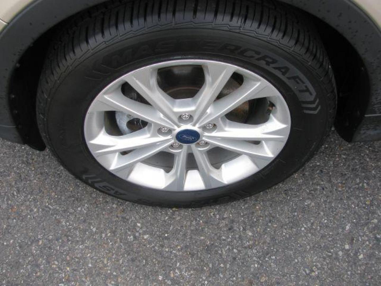 2017 Gold Ford Escape SE (1FMCU0GD1HU) with an EcoBoost 1.5L I-4 gasoline direct injection engine, Automatic transmission, located at 2443 Albert Pike, Hot Springs, AR, 71913, (501) 623-6255, 34.492222, -93.109993 - Photo#6