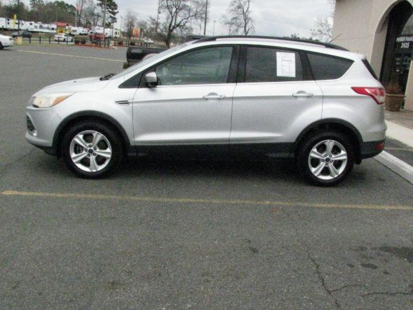 2016 Silver Ford Escape SE (1FMCU9G92GU) with an EcoBoost 2L I-4 gasoline direct injection engine, Automatic transmission, located at 2443 Albert Pike, Hot Springs, AR, 71913, (501) 623-6255, 34.492222, -93.109993 - Photo#1