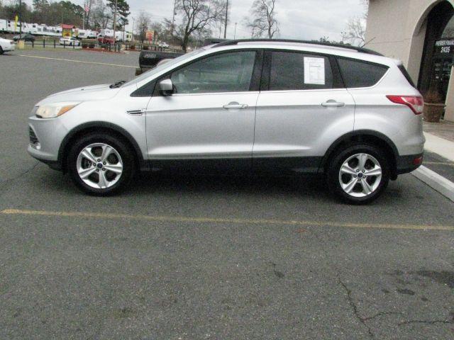 2016 Silver Ford Escape SE (1FMCU9G92GU) with an EcoBoost 2L I-4 gasoline direct injection engine, Automatic transmission, located at 2443 Albert Pike, Hot Springs, AR, 71913, (501) 623-6255, 34.492222, -93.109993 - Photo#1