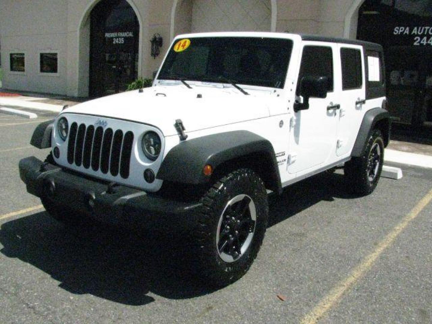2014 White Jeep Wrangler Unlimited Sport (1C4BJWDG0EL) with an 3.6L V-6 DOHC engine, Automatic transmission, located at 2443 Albert Pike, Hot Springs, AR, 71913, (501) 623-6255, 34.492222, -93.109993- Photo#0