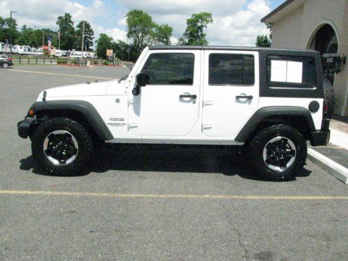 2014 White Jeep Wrangler Unlimited Sport (1C4BJWDG0EL) with an 3.6L V-6 DOHC engine, Automatic transmission, located at 2443 Albert Pike, Hot Springs, AR, 71913, (501) 623-6255, 34.492222, -93.109993- Photo#1