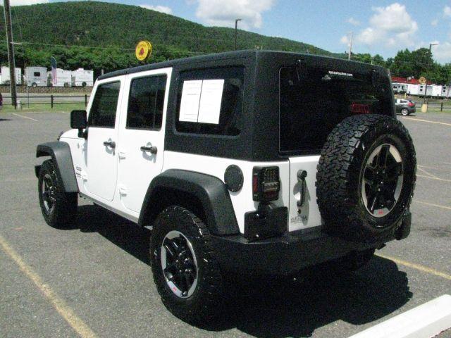 2014 White Jeep Wrangler Unlimited Sport (1C4BJWDG0EL) with an 3.6L V-6 DOHC engine, Automatic transmission, located at 2443 Albert Pike, Hot Springs, AR, 71913, (501) 623-6255, 34.492222, -93.109993- Photo#2