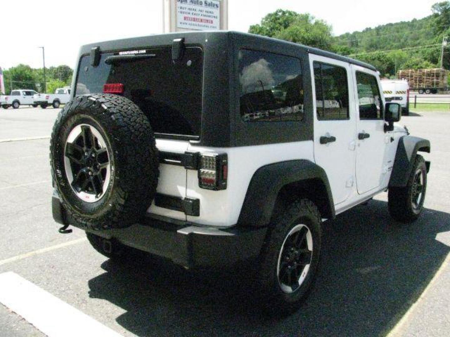 2014 White Jeep Wrangler Unlimited Sport (1C4BJWDG0EL) with an 3.6L V-6 DOHC engine, Automatic transmission, located at 2443 Albert Pike, Hot Springs, AR, 71913, (501) 623-6255, 34.492222, -93.109993- Photo#3
