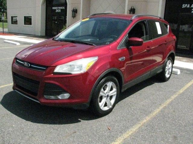 2016 Maroon Ford Escape SE (1FMCU0GX9GU) with an EcoBoost 1.6L I-4 gasoline direct injection engine, Automatic transmission, located at 2443 Albert Pike, Hot Springs, AR, 71913, (501) 623-6255, 34.492222, -93.109993- Photo#0